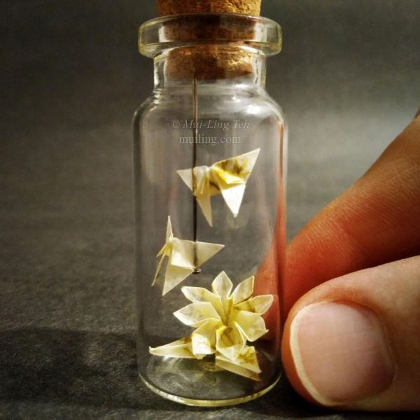 Miniature origami cranes and butterflies by Mui-Ling Teh